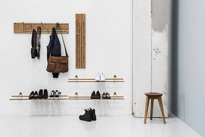 lifestyle shot of we do wood scoreboards, shoe rack and button stool with industrial styling.  Modern, minimal designs, sustainably made in bamboo.