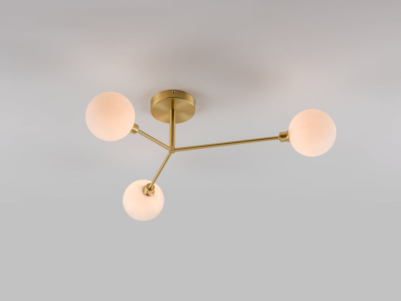 3 light flush ceiling light by houseof. product shot lights on under side view #colour_brass